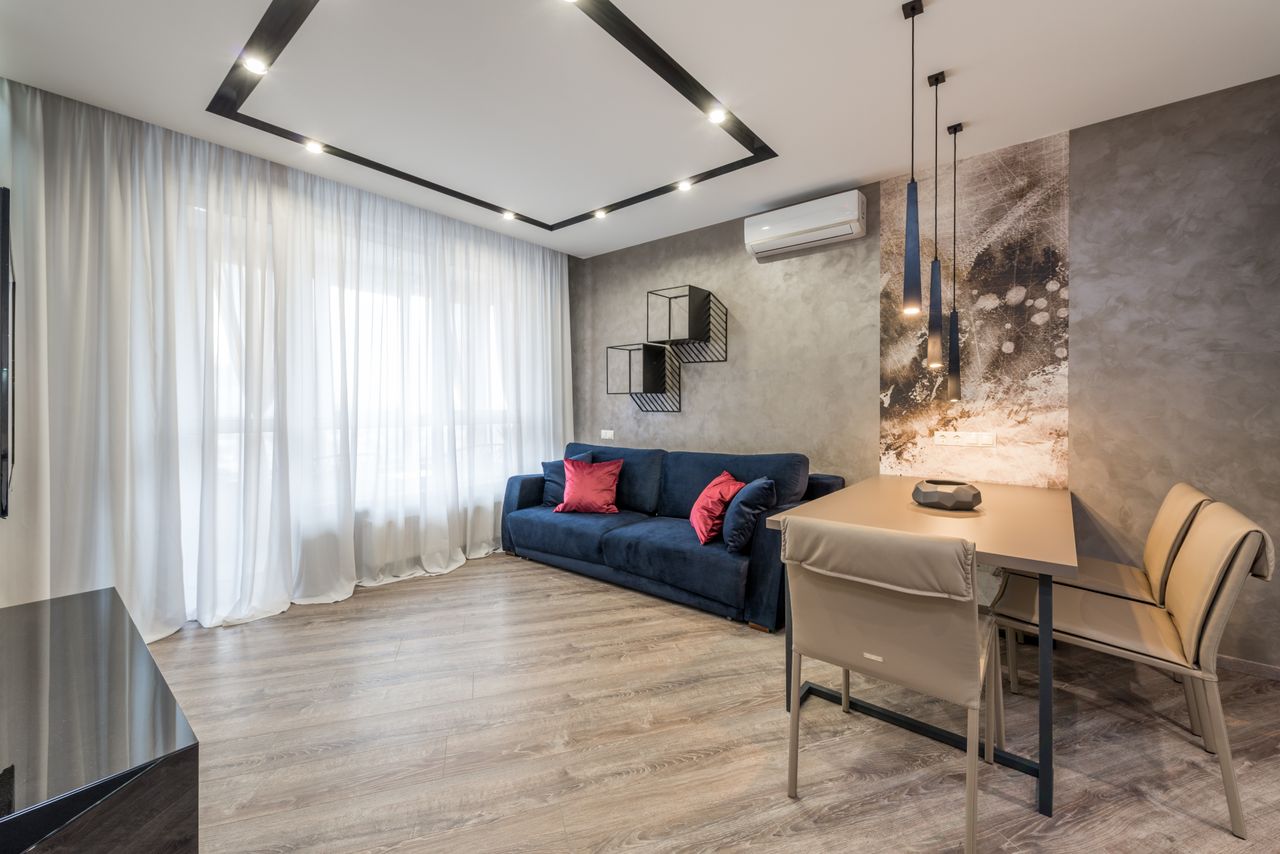 about-us-img Stylish modern living room featuring minimalist design with elegant furnishings.